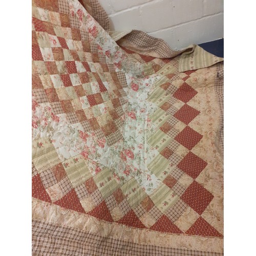 93 - A late 20th Century shop bought and machine made patchwork quilt 75