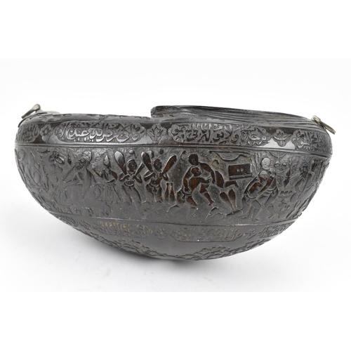 142 - A carved Persian coco de mer Kashkul/begging bowl, 19th century, decorated with Shah Tahmasp and Hum... 