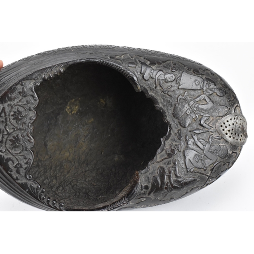 142 - A carved Persian coco de mer Kashkul/begging bowl, 19th century, decorated with Shah Tahmasp and Hum... 