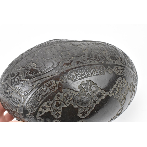 142 - A carved Persian coco de mer Kashkul/begging bowl, 19th century, decorated with Shah Tahmasp and Hum... 