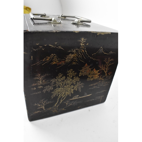 149 - A Mah-Jong set within a black, and red lacquer box decorated with gilt chinoiserie, the slide front ... 