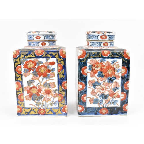 152 - A pair of 19th century Japanese imari tea caddies, of rectangular form with blue and red floral desi... 