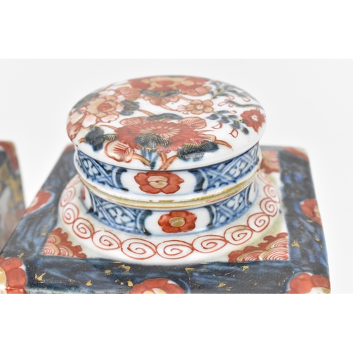 152 - A pair of 19th century Japanese imari tea caddies, of rectangular form with blue and red floral desi... 