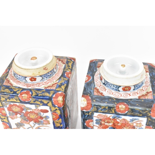 152 - A pair of 19th century Japanese imari tea caddies, of rectangular form with blue and red floral desi... 