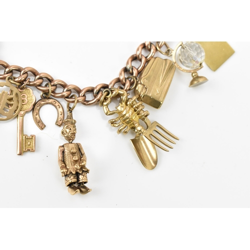 189 - A 9ct rose gold charm bracelet, with a Victorian 1900 half sovereign coin, and various hanging charm... 