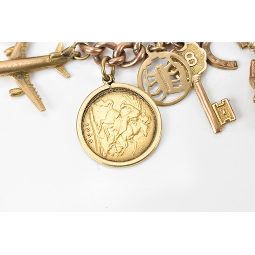 189 - A 9ct rose gold charm bracelet, with a Victorian 1900 half sovereign coin, and various hanging charm... 