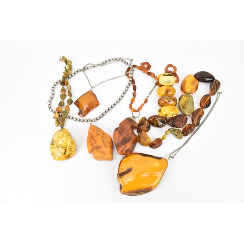 190 - A collection of raw and polished baltic amber jewellery, comprising large pendants, bracelets and ne... 