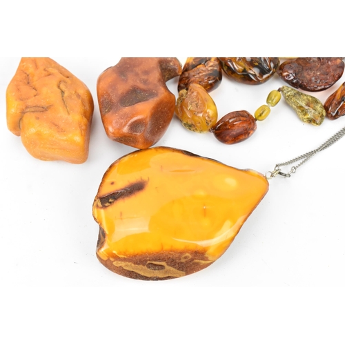 190 - A collection of raw and polished baltic amber jewellery, comprising large pendants, bracelets and ne... 