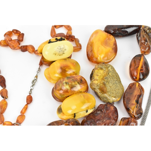 190 - A collection of raw and polished baltic amber jewellery, comprising large pendants, bracelets and ne... 