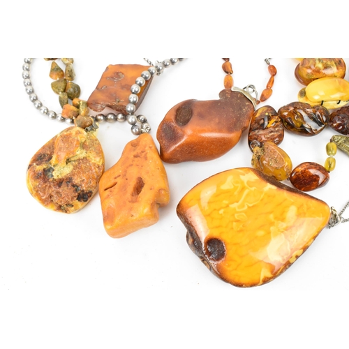 190 - A collection of raw and polished baltic amber jewellery, comprising large pendants, bracelets and ne... 