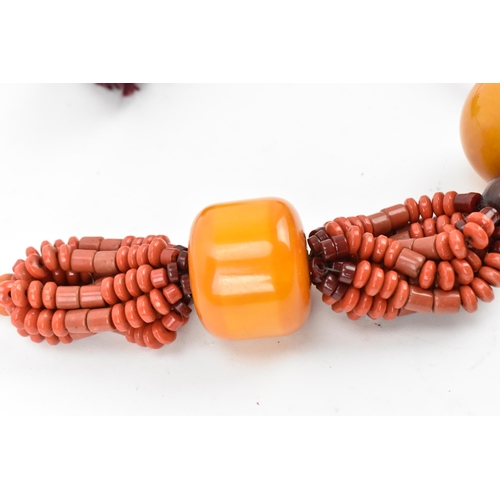 193 - A Moroccan Berber style pressed amber and coral bead necklace, with braided wool fastening, central ... 