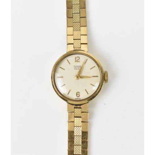 24 - A Tudor, manual wind, ladies, 9ct gold wristwatch, having a white dial, baton markers, Rolex crown a... 