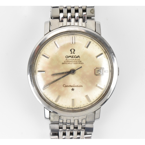44 - An Omega Constellation, automatic, gents, stainless steel wristwatch, having a silvered dial, centre... 
