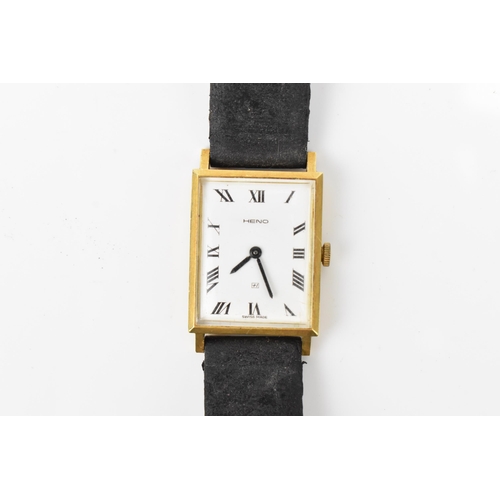 48 - A Heno, manual wind, gents, 18ct gold wristwatch, having a white dial with Roman numerals, the caseb... 
