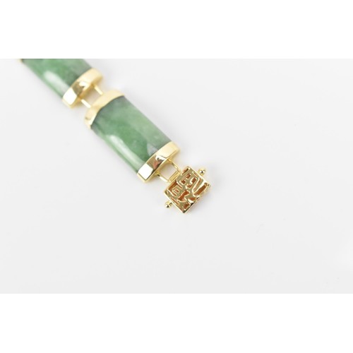 193 - A Chinese 14ct yellow gold and green jade coloured bracelet, with rectangular links, the clasp with ... 