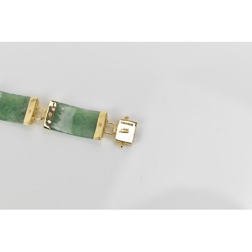 193 - A Chinese 14ct yellow gold and green jade coloured bracelet, with rectangular links, the clasp with ... 