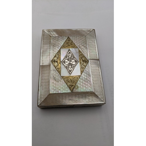 109 - A silver floral vesta cast having engraved initials together with two mother of pearl card cases A/F... 