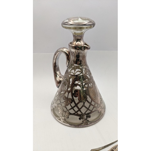 118 - Silver and white metal to include a silver lidded jar and spoon, a floral white metal overlaid decan... 