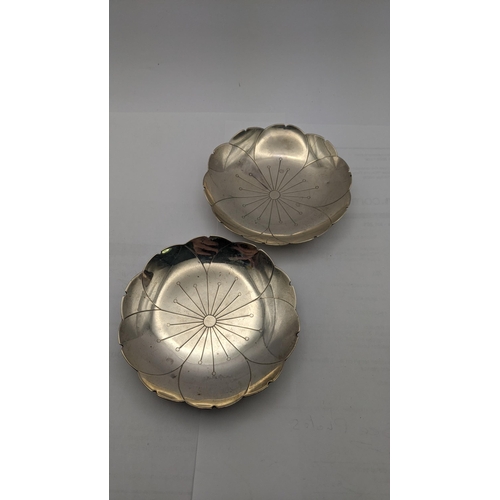 161 - A pair of silver pin dishes fashioned as flowers 168.1g together with a silver weighted spill vase
L... 