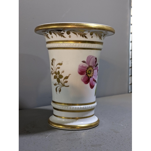 258 - An early 19th century spill vase attributed to H & R Daniel, painted with flowers and gilt highlight... 