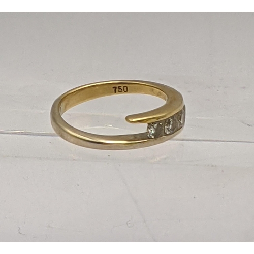 28 - An 18ct gold ring inset with four diamonds, total weight 4.1g Location: RING