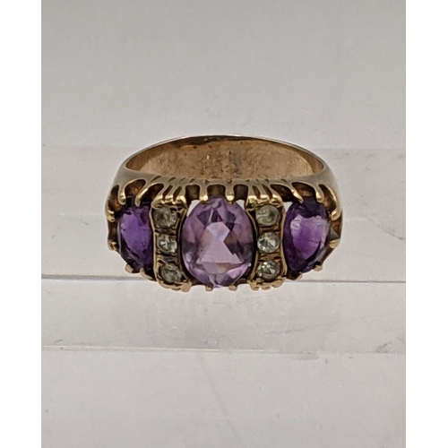 32 - A 9ct gold ring set with amethyst and sapphires total weight 5.1g 
Location: RING