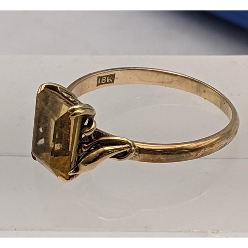 44 - An 18ct gold ring set with a citrine and a ladies 9ct gold Tissot wrist watch on a rolled gold brace... 