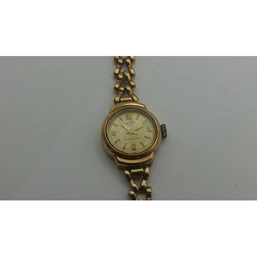 64 - A 9ct gold Enicar ladies watch 
Location: CAB2