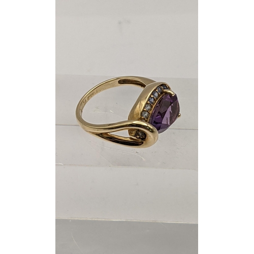 73 - A 9ct gold pear cut amethyst and sapphire ring, total weight 3.8g 
Location: RING