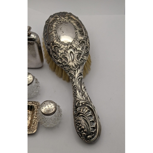 82 - Silver comprising two ashtrays, a hairbrush, a salt and pepper, a sugar caster and a silver plated s... 