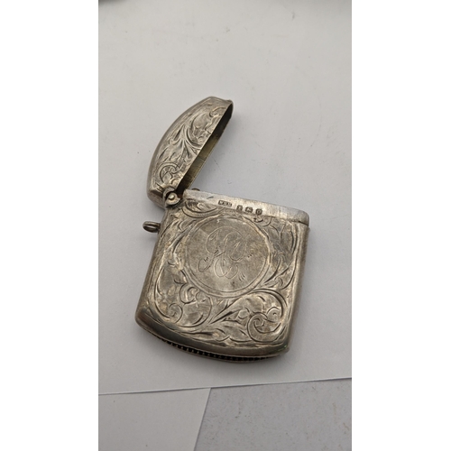 87 - Mixed silver to include a pierced one footed dish, a silver pin tray along with a floral embossed ve... 