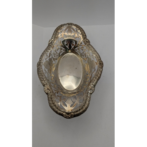 87 - Mixed silver to include a pierced one footed dish, a silver pin tray along with a floral embossed ve... 