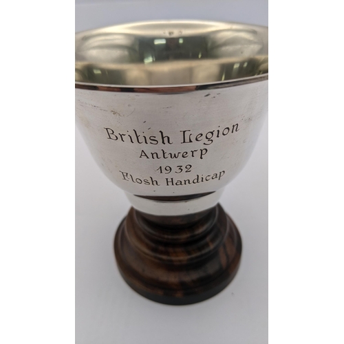 99 - A white metal trophy cup on a wooden base stamped 800, total weight excluding base 96.2g
Location: A... 