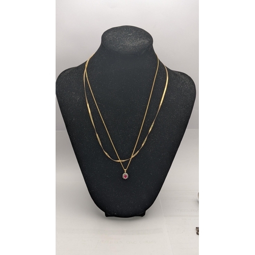 13 - A 9ct gold herringbone necklace together with a 9ct gold pendant set with a sapphire and paste stone... 