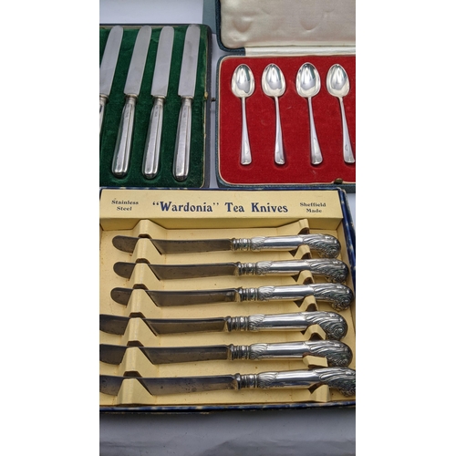 184 - Six silver tea spoons boxed, 22.4g together with a boxed set of six silver handled butter knives and... 