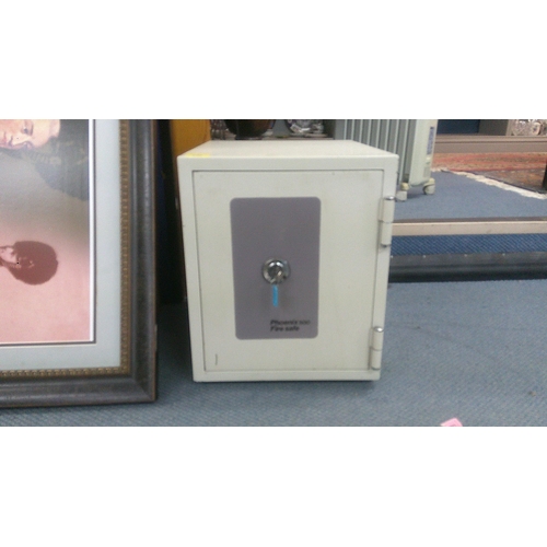 246 - A Phoenix 500 Fire safe with a shelved interior lockable with key, 43cm h, 35.5cm w, 42cm d
Location... 