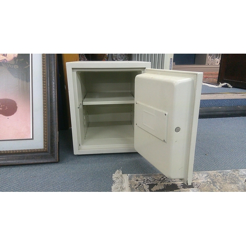 246 - A Phoenix 500 Fire safe with a shelved interior lockable with key, 43cm h, 35.5cm w, 42cm d
Location... 