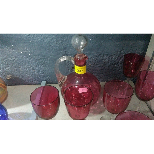 247 - Nine cranberry glass wines, a decanter A/F, and a Limoges dish
Location: 3.1