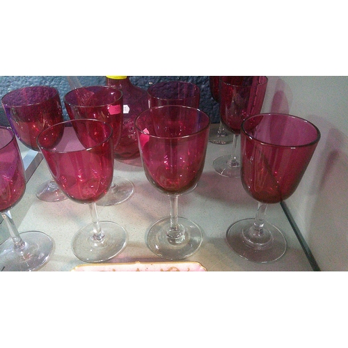 247 - Nine cranberry glass wines, a decanter A/F, and a Limoges dish
Location: 3.1