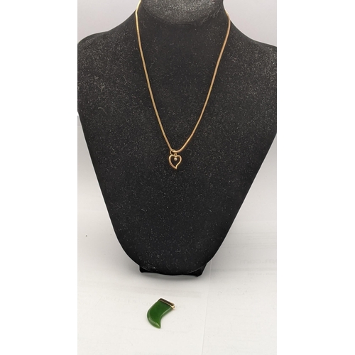 25 - A 9ct gold chain along with a jadeite tooth shaped pendant. 8.3g
Location: CAB6