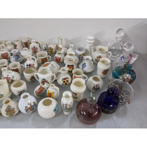 310 - A collection of crested China ornaments together with mixed scent bottles
Location: LAF