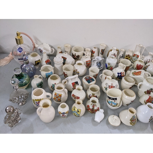 310 - A collection of crested China ornaments together with mixed scent bottles
Location: LAF