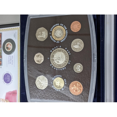 313 - A quantity of commemorative coins and coin sets to include 2000 UK Brilliant uncirculated proof set,... 