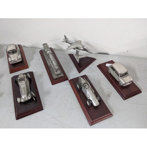 316 - A collection of Royal Hampshire pewter collectors models of cars
Location: 6.3