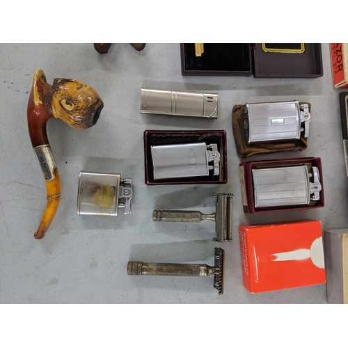 319 - Pipes, lighters and razors to include: six Ronson lighters (4 boxed) one Calvin Hill lighter, a King... 