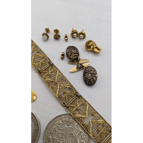 5 - A mixed lot to include a yellow metal tooth and St Christopher's pendant, 2.5, filigree bracelet, tw... 