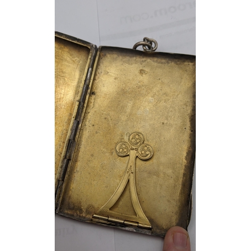 7 - An early 20th century silver cigarette case having a gilded interior and silver import marks, on a s... 