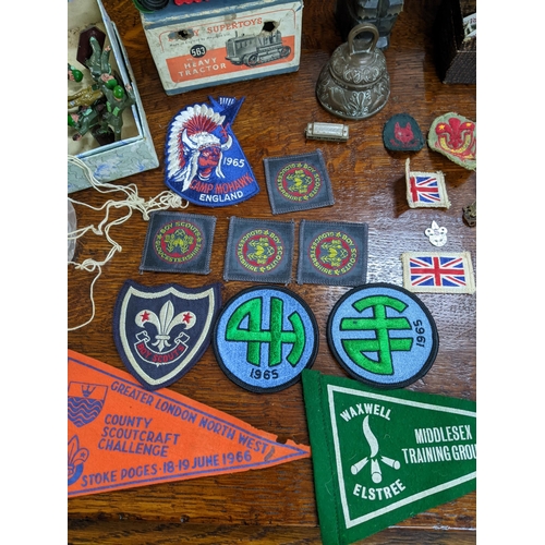 273 - A mixed lot of 1960s cloth and metal boy scout badges, diecast Dinky Toy vehicles including a boxed ... 