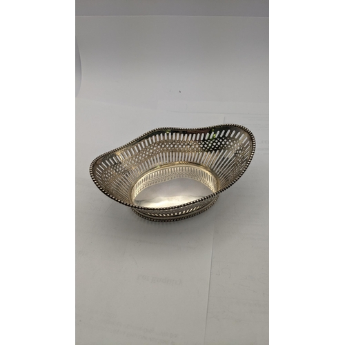16 - A White metal pierced oval shaped dish stamped 800, total weight 104.5g
Location: R1.3