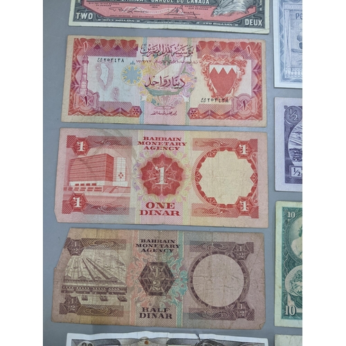 379 - Mixed banknotes from around the world to include a 1973 Hong Kong and Shanghai Banking corporation T... 